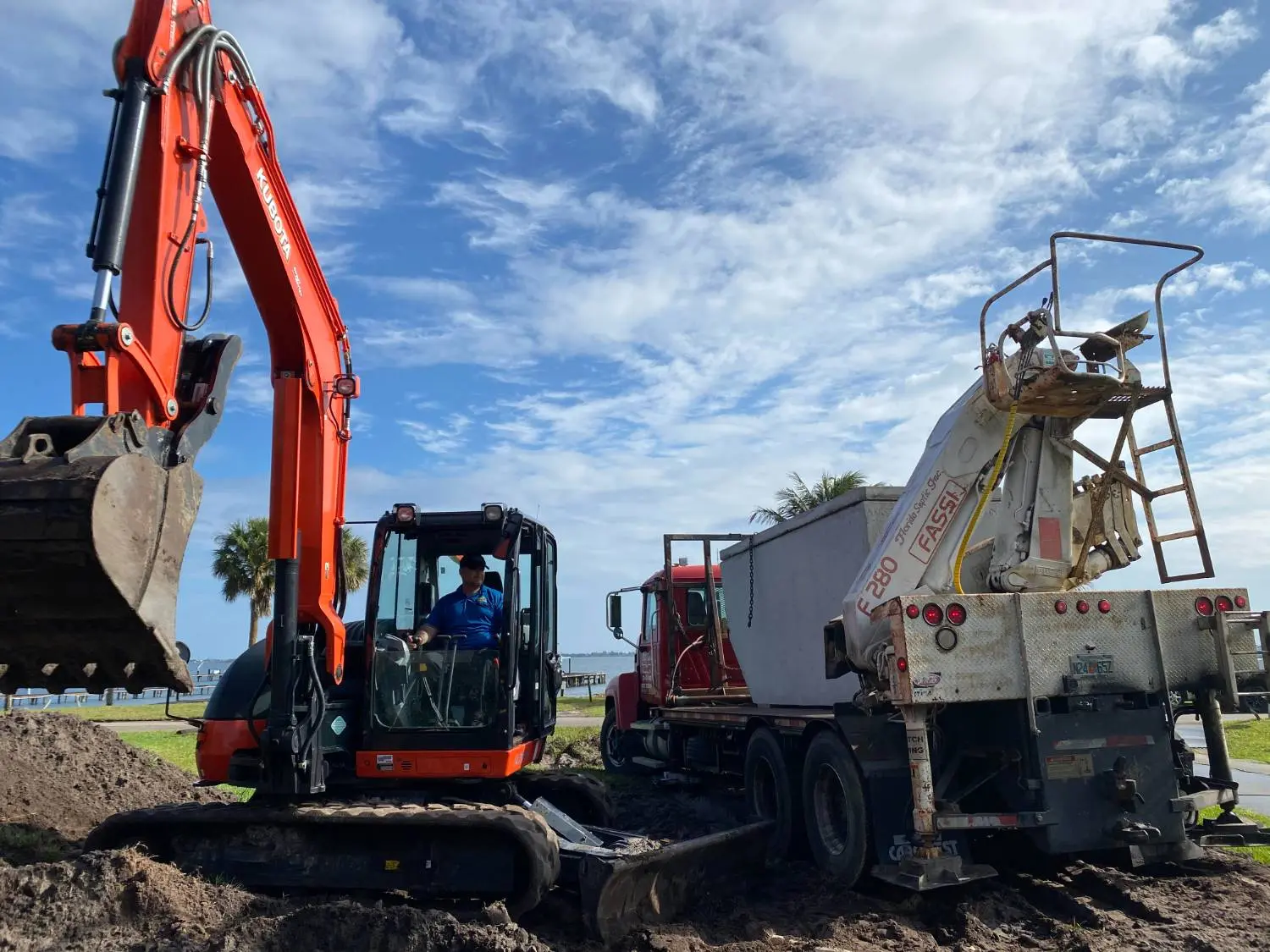 Crotty Services excavator and truck on a tank install
