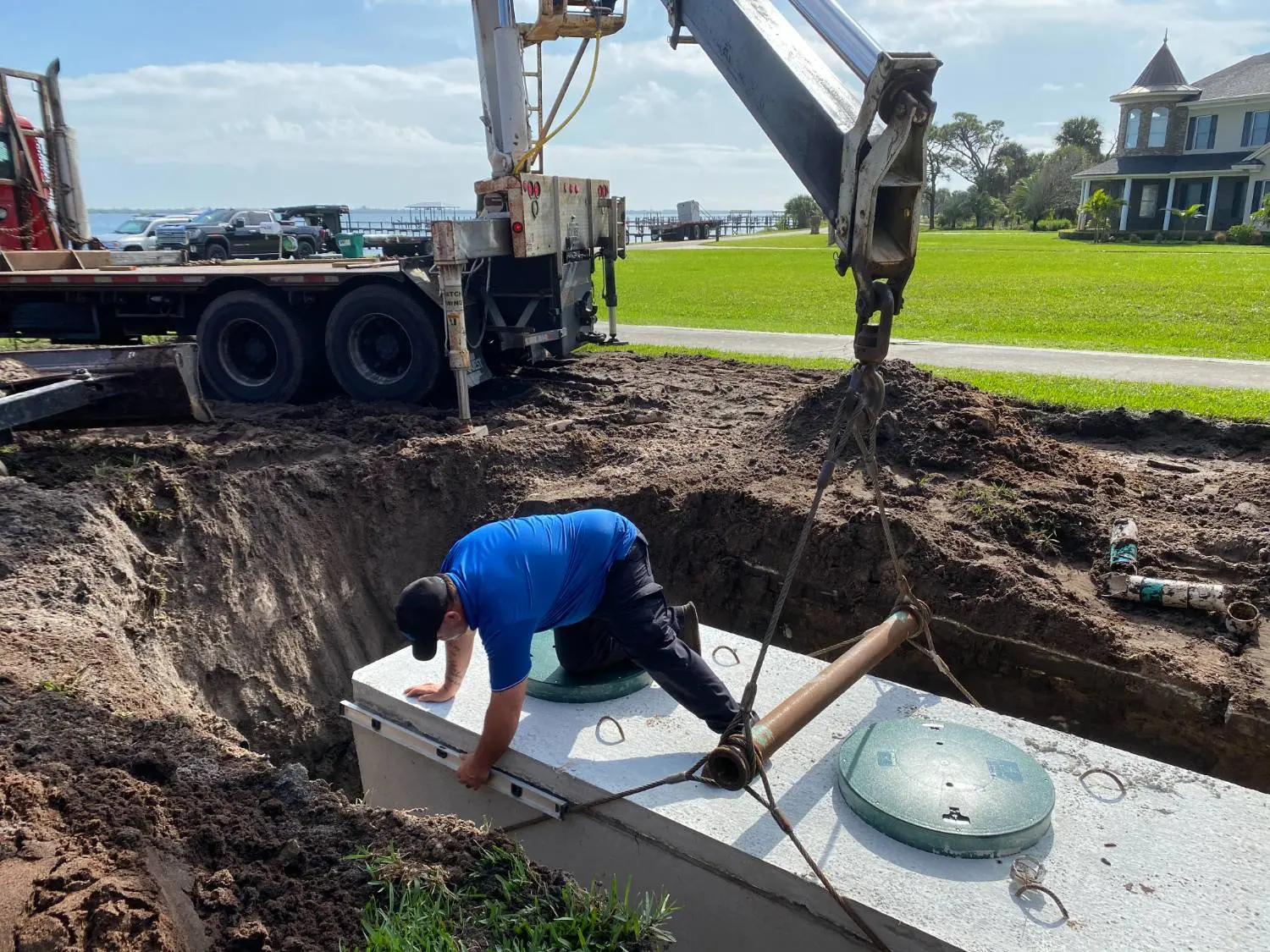 Crotty Services crew member connecting a new septic tank