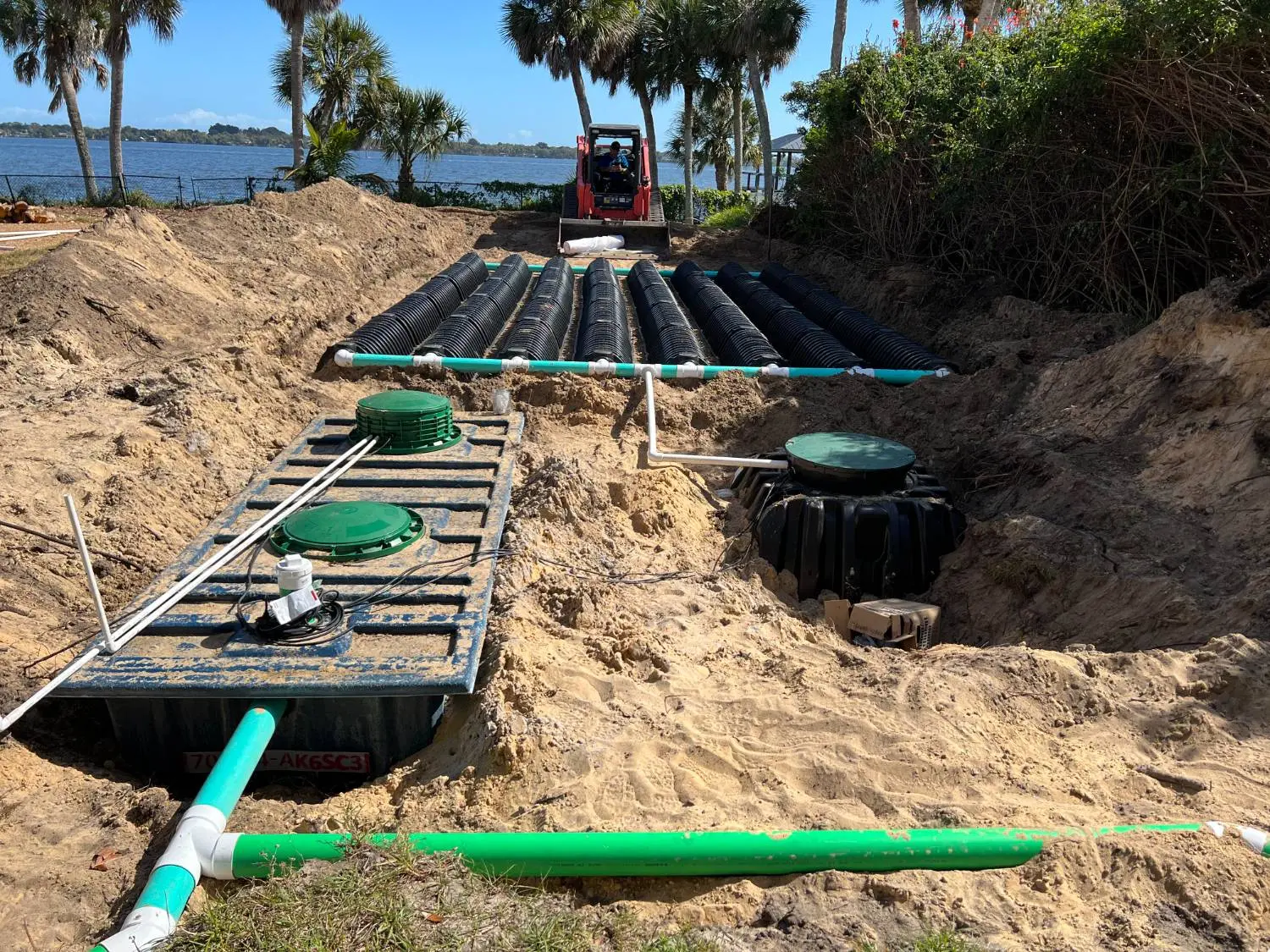 Drainfield being installed on a sandy residential lot
