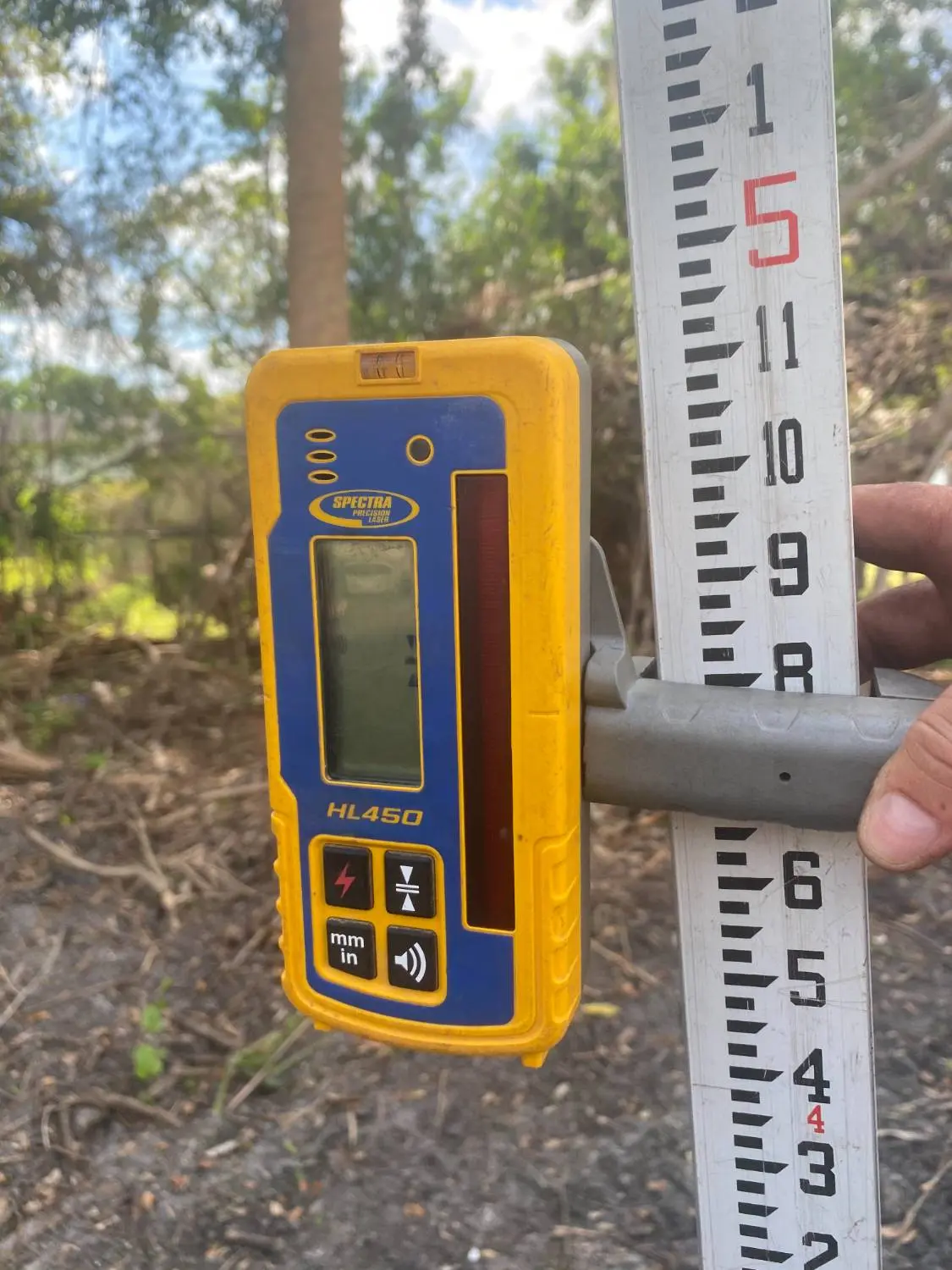 Soil test probe measuring depth in the ground